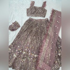 Lehenga, Indian, Punjabi party suit. Pink, purple, mauve. Feathers.